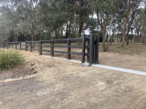 PVC Post & Rail fence- Concrete footing with Sliding gate track