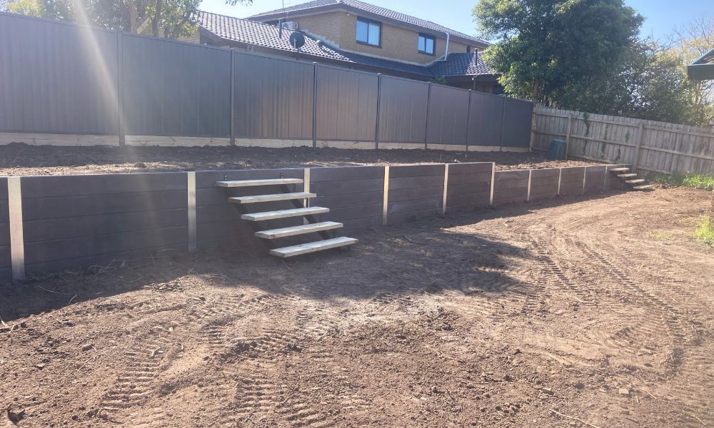 New Colorbond fence & Concrete Sleeper retaining wall with Stairs